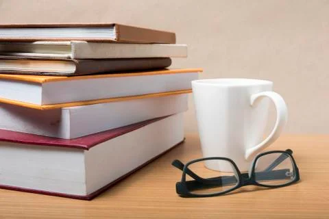 Stack of book with coffee mug Stock Photos