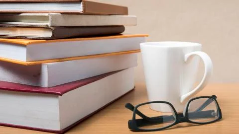 Stack of book with coffee mug Stock Photos