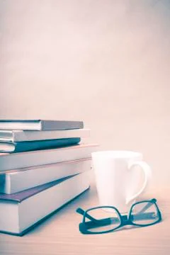 Stack of book with coffee mug vintage style Stock Photos