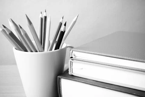 Stack of book with color pencil black and white color tone style Stock Photos