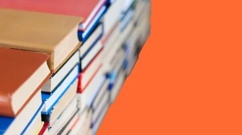 Stack of book on red orange lush lava background, education concept, back to  Foto stock