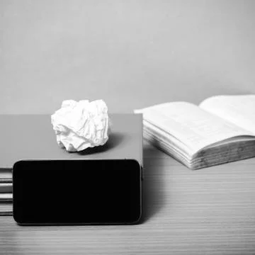 Stack of book with smart phone black and white color tone style Stock Photos