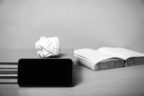 Stack of book with smart phone black and white color tone style Stock Photos