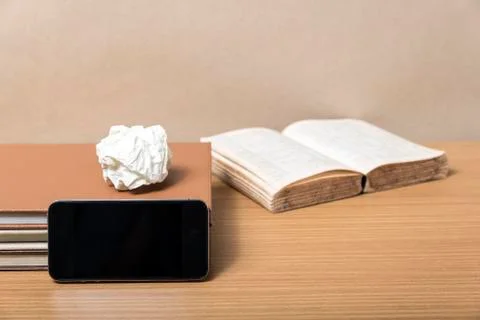 Stack of book with smart phone Stock Photos