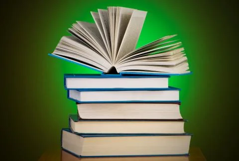 Stack of books against gradient background Stock Photos