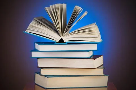 Stack of books against gradient background Stock Photos