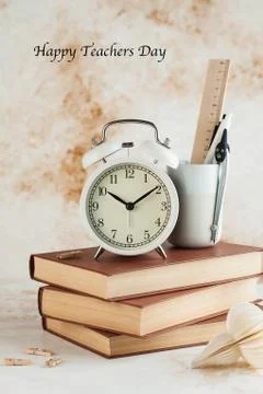 Stack of Books with Alarm Clock. World teacher's day. Copy space Foto stock