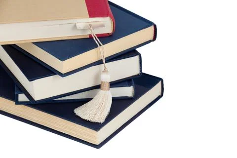 A stack of books and a bookmark Stock Photos