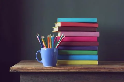 Stack of books  and colored pencils. Back to school. Stock Photos
