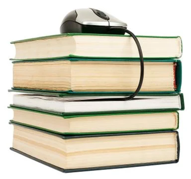 Stack books and computer mouse Foto stock