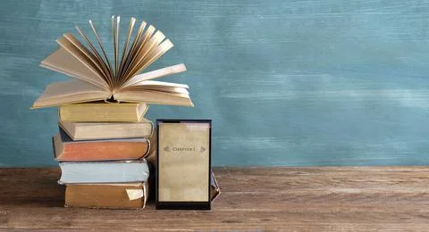 Stack of books and an e-book reader. E- Book, E-Learning,education concept Stock Photos