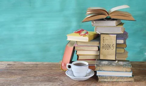 Stack of books and an e-book reader. E- Book, book fair,reading,realaxing Stock Photos