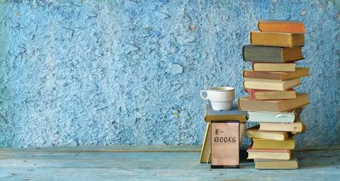 Stack of books and an e-book reader. E- Book, book fair,reading,realaxing Stock Photos