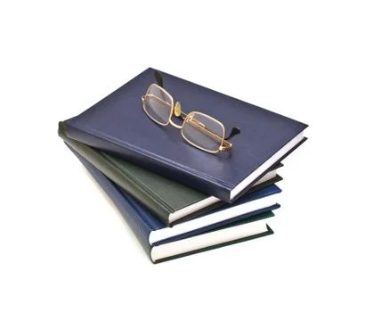 Stack of books and glasses, isolated on white background Stock Photos