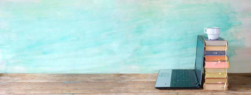 Stack of books and a laptop computer. Back to school, reading, education concept Stock Photos