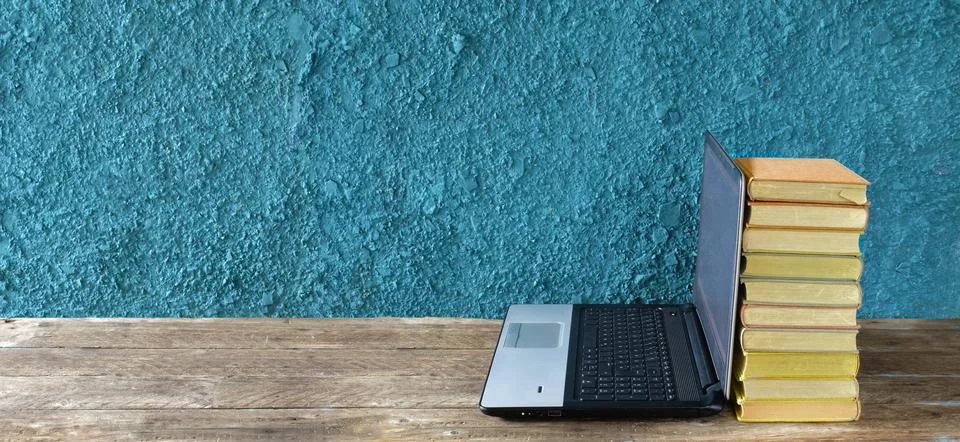 Stack of books and laptop computer,home office, homeschooling,educatiion Stock Photos