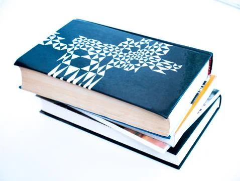 Stack of books and notebooks on a white background Stock Photos