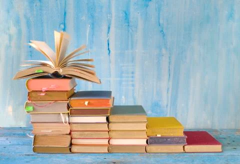 Stack of books and  open book. Reading,literature,education,library,home offfice Stock Photos