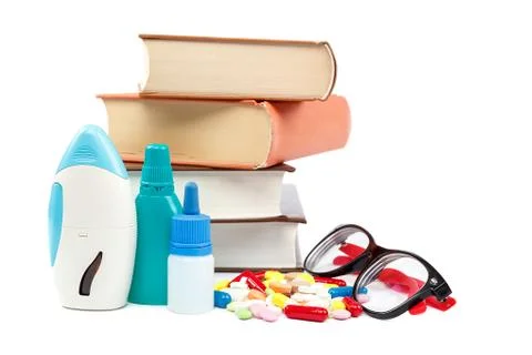 Stack of books and pills, capsules. Medicaments. Stock Photos