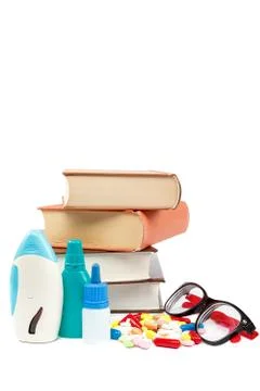 Stack of books and pills, capsules. Medicaments. Stock Photos