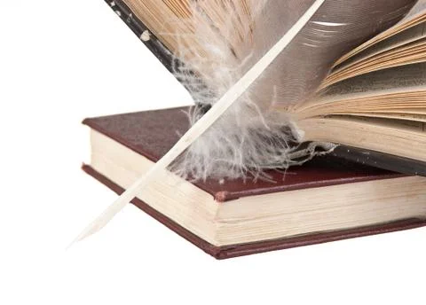 Stack of books and quill Foto stock
