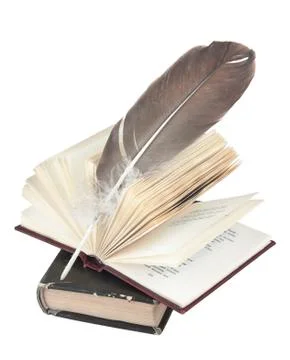 Stack of books and quill Foto stock