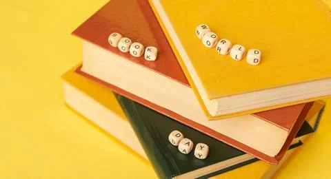 Stack of books and text World Book Day. Education background. Literacy day Stock Photos
