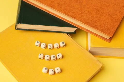 Stack of books and text World Book Day. Education background. Literacy day Stock Photos
