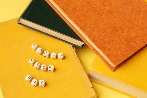 Stack of books and text World Book Day. Education background. Literacy day Stock Photos