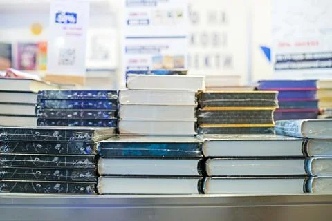 A stack of books and textbooks at a publishing house at a book festival 스톡 사진
