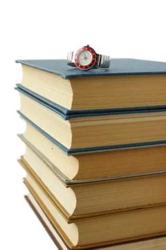 Stack of books and watches Foto stock