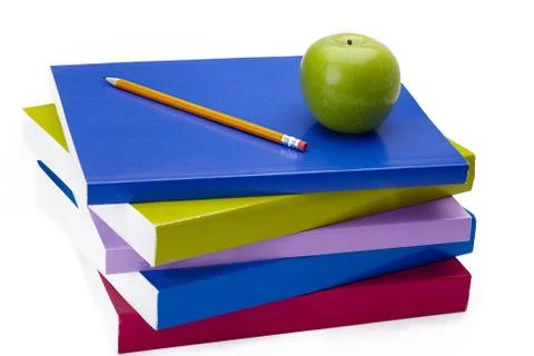 Stack of books with apple and pencil on top Stock Photos