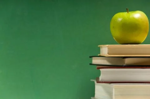 Stack of books with apple Stock Photos
