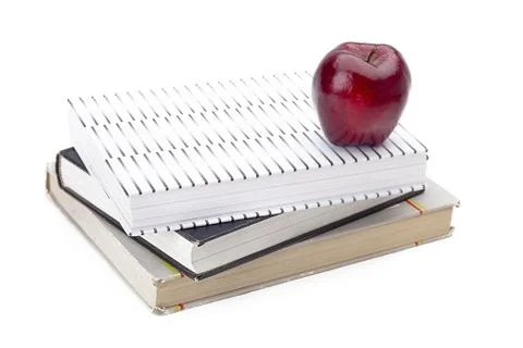 Stack of books with an apple on top Stock Photos