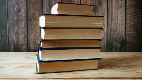 Stack of books background, many books piles, stop motion animation 스톡 동영상 146320426