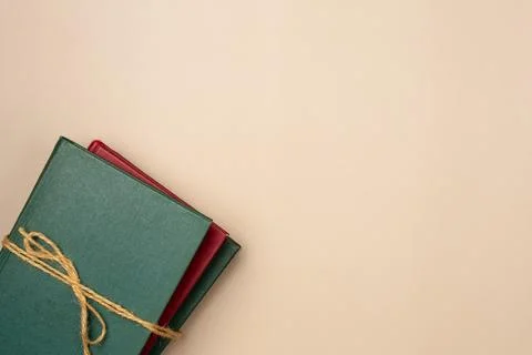 Stack of books on a beige background. Leisure concept, reading a book. Copy s Stock Photos