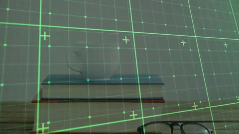 Stack of books being displayed in augmented reality, showing eyeglasses and Stock Footage 307445692