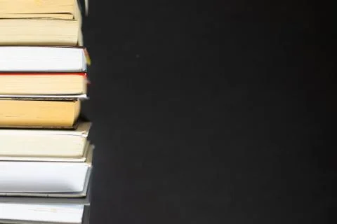 Stack of books on black background Stock Photos