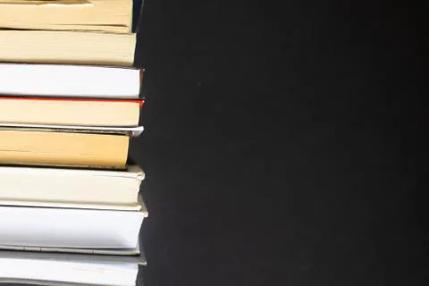 Stack of books on black background Stock Photos