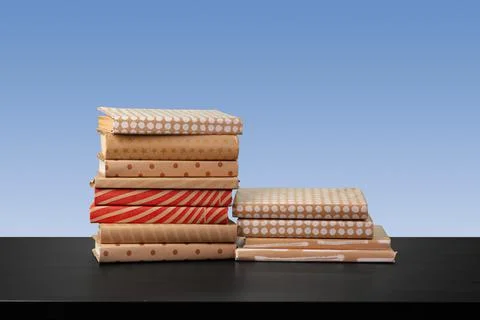 Stack of books on black wooden table 写真素材