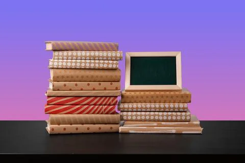 Stack of books on black wooden table 스톡 사진