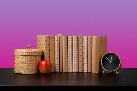 Stack of books on black wooden table Stock Photos