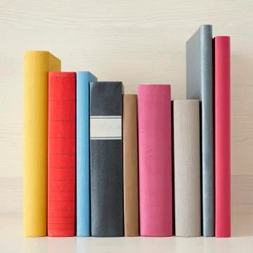 Stack of books in the bookself Stock Photos