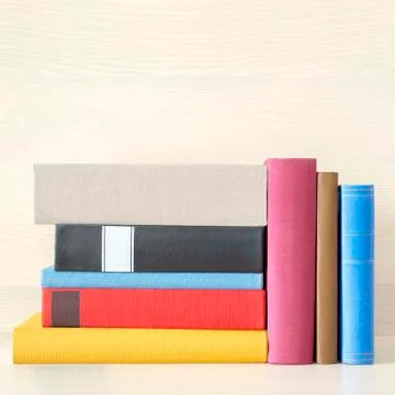 Stack of books in the bookself Stock Photos