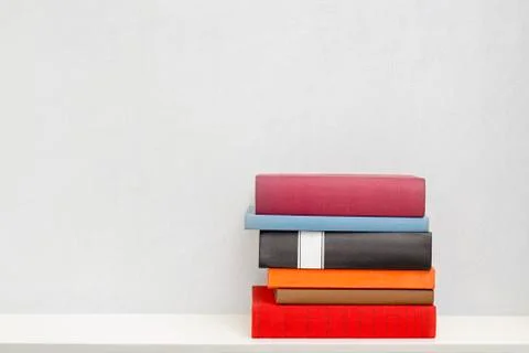 Stack of books in the bookself Stock Photos