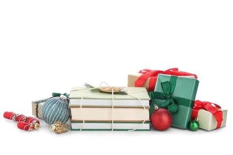 Stack of books with Christmas balls and gift boxes on white background Stock Photos