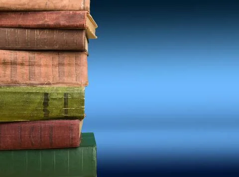 Stack of books on the color gradient background, space for text Stock Photos