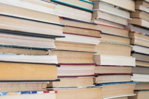 A stack of books with colorful covers. The library or bookstore Stock Photos