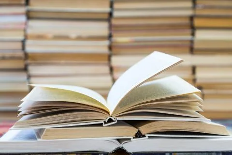 A stack of books with colorful covers. The library or bookstore Stock Photos