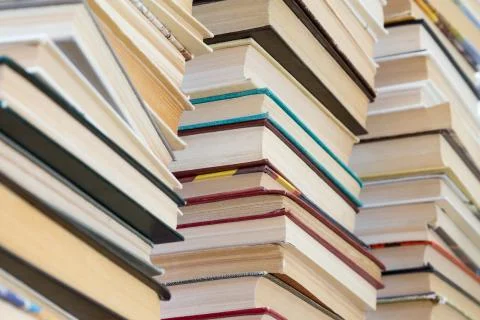 A stack of books with colorful covers. The library or bookstore Stockfoto's